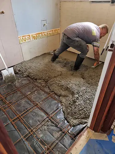 Albany Bathroom Reno - Before - New Concrete Floor Being Levelled